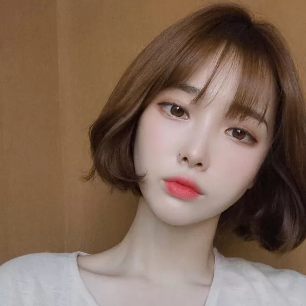 tóc ngắn cho mặt dài uốn cụp